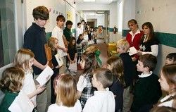 STATION TO STATION - Sophomore theology students from Archbishop Bergan Catholic High School hold the Stations of the Cross while kindergartners and first graders at Archbishop Bergan Elementary move from station to station Feb. 22. Reading the station is Lauren Glowacki. (Lisa Maxson/Staff) STATION TO STATION - Sophomore theology students from Archbishop Bergan Catholic High School hold the Stations of the Cross while kindergartners and first graders at Archbishop Bergan Elementary move from station to station Feb. 22. Reading the station is Lauren Glowacki. (Lisa Maxson/Staff)