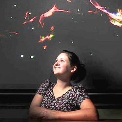 22-year-old Amy Fraser-McKelvie during a holiday internship with a team at Monash University's School of Physics located the mystery material within vast structures called 'filaments of galaxies.' 22-year-old Amy Fraser-McKelvie during a holiday internship with a team at Monash University's School of Physics located the mystery material within vast structures called 'filaments of galaxies.'