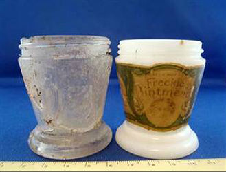 Found in five broken pieces, when reassembled the glass fragments make up a nearly complete jar identical in shape to the ones used by Dr. C. H. Berry's Freckle Ointment. Found in five broken pieces, when reassembled the glass fragments make up a nearly complete jar identical in shape to the ones used by Dr. C. H. Berry's Freckle Ointment.