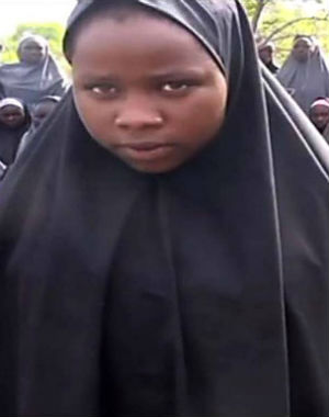 In the video, approximately 130 girls are shown acting quiet, docile and passive against a rural backdrop. In the video, approximately 130 girls are shown acting quiet, docile and passive against a rural backdrop.