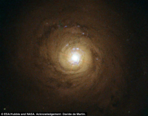NGC 5548 has a supermassive black hole in its center which is dimmed by its own winds. NGC 5548 has a supermassive black hole in its center which is dimmed by its own winds.