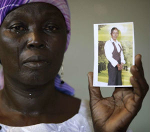 Martha Mark, the mother of kidnapped school girl Monica Mark cries as she displays her photo, in the family house, in Chibok, Nigeria. Martha Mark, the mother of kidnapped school girl Monica Mark cries as she displays her photo, in the family house, in Chibok, Nigeria.