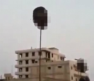Soldier's heads were hoisted on poles as they were killed in Syria. Soldier's heads were hoisted on poles as they were killed in Syria.