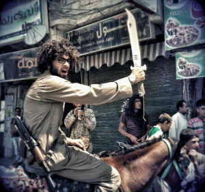 This Egyptian 'hipster jihadi' has been using Twitter in an attempt to glorify the actions of the Islamic Caliphate which has taken over much of Iraq and Syria. This Egyptian 'hipster jihadi' has been using Twitter in an attempt to glorify the actions of the Islamic Caliphate which has taken over much of Iraq and Syria.