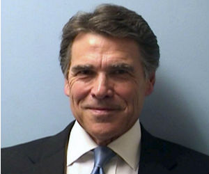 Under duress, Texas Governor Rick Perry maintained an upbeat and positive attitude. Arriving at the Travis County courthouse in Austin for booking and fingerprinting, Perry gave a warm smile for his mug shot. Under duress, Texas Governor Rick Perry maintained an upbeat and positive attitude. Arriving at the Travis County courthouse in Austin for booking and fingerprinting, Perry gave a warm smile for his mug shot.