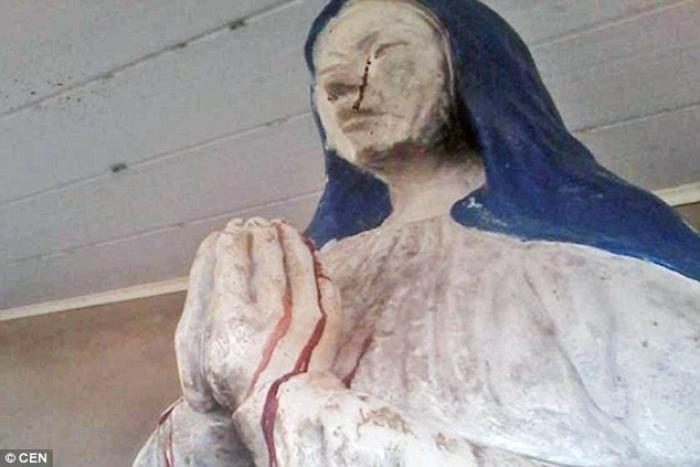 A picture of the weeping statue of the Virgin Mary. Parishioners say she is weeping blood. A picture of the weeping statue of the Virgin Mary. Parishioners say she is weeping blood.