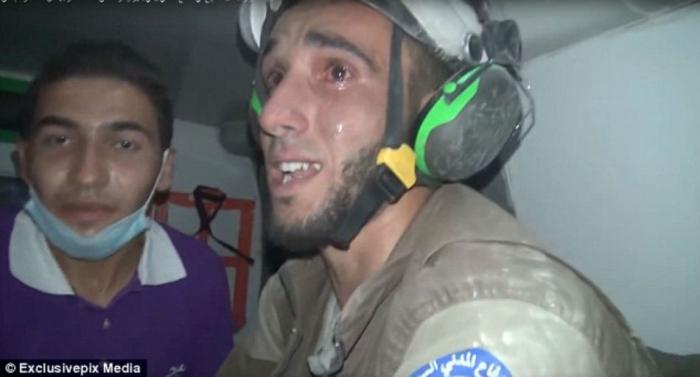 Rescuer Abu Kifah burst into tears when he realised the baby was alive.