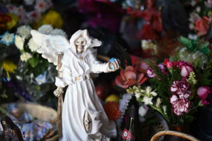 A statue of Santa Muerte. A statue of Santa Muerte.