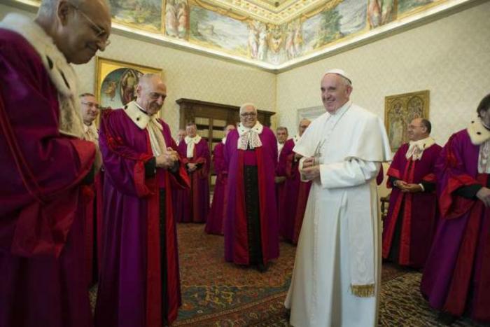 Pope Francis meets with the Roman Rota at the Vatican. Pope Francis meets with the Roman Rota at the Vatican.