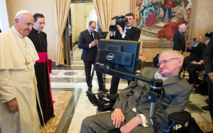 Pope Francis greets Stephen Hawking.