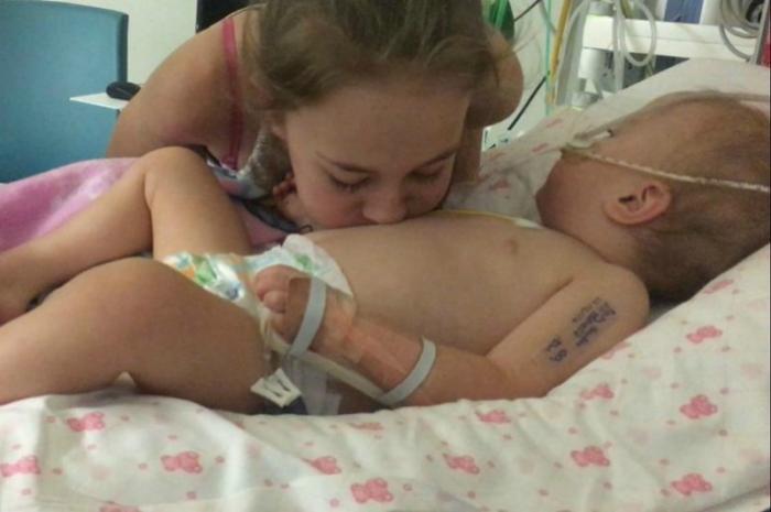 Baby Poppy was roused from her unresponsive state by Macey Baby Poppy was roused from her unresponsive state by Macey