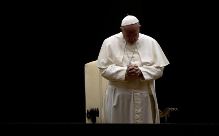 Pope Francis prays at St. Peter
