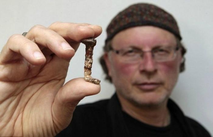Israeli-Canadian archaeologist Simcha Jacobovici holds one of two nails that were said to have been used to hold Jesus on the cross during the presentation of a documentary film at Tel Aviv University in Israel on April 6, 2011..