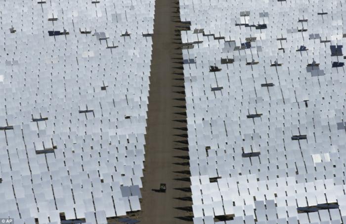 The computer-controlled mirrors, all 300,000 of them, are used to heat water in the boilers The computer-controlled mirrors, all 300,000 of them, are used to heat water in the boilers