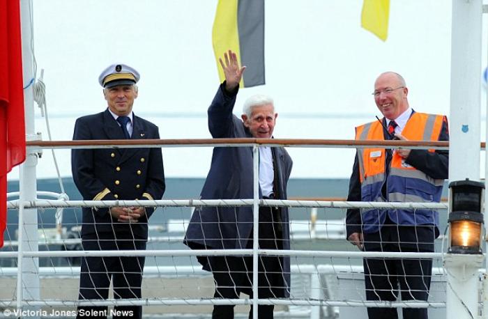 Bernard Jordan waves on deck with Captain Olivier Macoin (left) and ship duty manager Jim Crilley. Bernard Jordan waves on deck with Captain Olivier Macoin (left) and ship duty manager Jim Crilley.