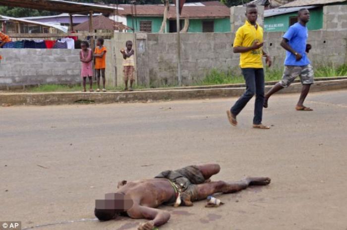 The body of a man who has been infected with the Ebola virus lies dead in the streets of Liberia. The body of a man who has been infected with the Ebola virus lies dead in the streets of Liberia.