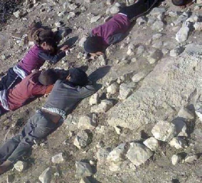 Children lie where they were killed by militants. 