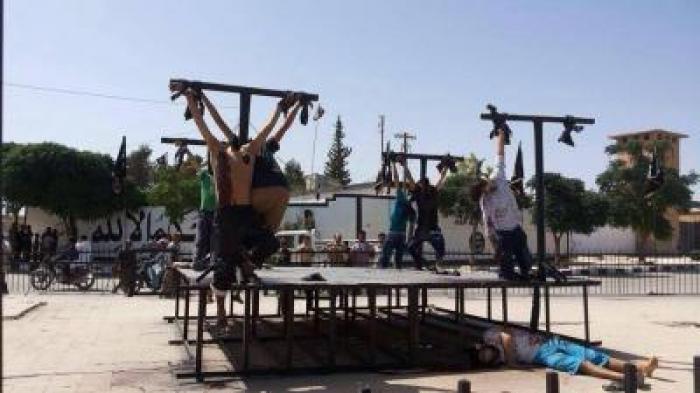 Convert or die. ISIS militants are crucifying victims because to them crucifixion is especially humi