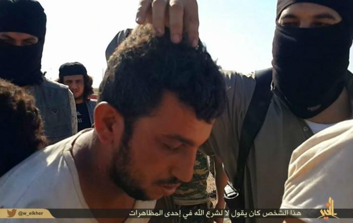 A man has his hair pulled, a form of insult in Islamic culture. He is about to die. A man has his hair pulled, a form of insult in Islamic culture. He is about to die.