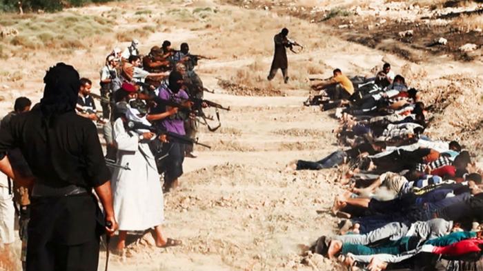 Militants from the Islamic State execute a group of Iraqis. Militants from the Islamic State execute a group of Iraqis.