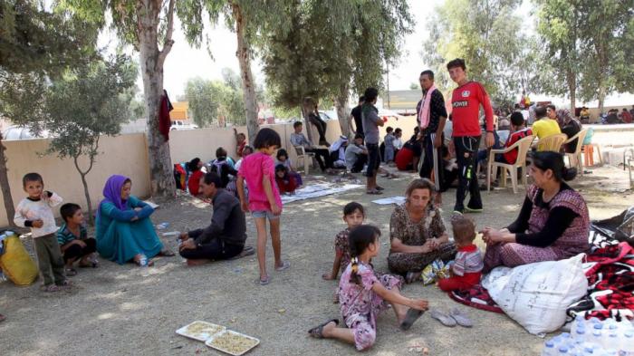 Displaced people from the minority Yazidi sect, fleeing the violence in the Iraqi town of Sinjar wes Displaced people from the minority Yazidi sect, fleeing the violence in the Iraqi town of Sinjar wes