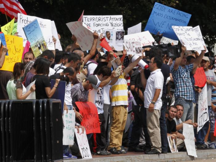 Protesters ask for help for Yazidi people who are stranded by violence in northern Iraq. Protesters ask for help for Yazidi people who are stranded by violence in northern Iraq.