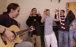 Erin Haskell, a parishoner at Immaculate Conception Church in Greene, plays some worship songs on her guitar for other youths attending the FX Youth Rally at St. Matthew's School. Image of Erin Haskell, a parishoner at Immaculate Conception Church in Greene, plays some worship songs on her guitar for other youths attending the FX Youth Rally at St. Matthew's School.