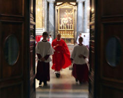 VATICAN ALTAR BOYS WALK WITH PRIEST PRIOR TO MASS IN BASILICA - Vatican altar boys and a priest walk from a sacristry to celebrate the first morning Mass in St. Peter's Basilica at the Vatican Aug. 8. (CNS/Catholic Press Photo) VATICAN ALTAR BOYS WALK WITH PRIEST PRIOR TO MASS IN BASILICA - Vatican altar boys and a priest walk from a sacristry to celebrate the first morning Mass in St. Peter's Basilica at the Vatican Aug. 8. (CNS/Catholic Press Photo)