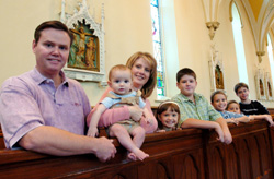 DEACON PICTURED WITH FAMILY IN NEW YORK CHURCH
Deacon Dean Condon and his wife, Janet, and their children, from left, 10-month-old Daniel, 5-year-old Rachel, 13-year-old David, 10-year-old Paul, 7-year-old Timothy and 14-year-old Josh, are pictured in All Saints Church in Corning, N.Y., in early Sep tember. Deacon Condon and his large family moved into the parish rectory in July. The 44-year-old deacon had spent the previous 11 years as pastoral administrator at Guardian Angels Parish in Henrietta, N.Y. (CNS photo/Mike Crupi, Catholic Courier) Image of DEACON PICTURED WITH FAMILY IN NEW YORK CHURCH
Deacon Dean Condon and his wife, Janet, and their children, from left, 10-month-old Daniel, 5-year-old Rachel, 13-year-old David, 10-year-old Paul, 7-year-old Timothy and 14-year-old Josh, are pictured in All Saints Church in Corning, N.Y., in early Sep tember. Deacon Condon and his large family moved into the parish rectory in July. The 44-year-old deacon had spent the previous 11 years as pastoral administrator at Guardian Angels Parish in Henrietta, N.Y. (CNS photo/Mike Crupi, Catholic Courier)