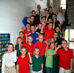 STUDENT WITH BRAIN TUMOR SURROUNDED BY CLASSMATES, TEACHERS - Chad Scanlon, in a blue jacket, a sixth-grader at Holy Trinity School in Ligonier, Pa., is surrounded in 2006 by classmates, friends and teachers who had gotten buzz cuts to support him during his cancer treatments. While Chad has been battling a brain tumor, he has kept his focus on other things, including making a collection of postcards from all 50 states and every country around the world. (CNS photo/Ed Zelachoski, The Catholic Accent) Image of STUDENT WITH BRAIN TUMOR SURROUNDED BY CLASSMATES, TEACHERS - Chad Scanlon, in a blue jacket, a sixth-grader at Holy Trinity School in Ligonier, Pa., is surrounded in 2006 by classmates, friends and teachers who had gotten buzz cuts to support him during his cancer treatments. While Chad has been battling a brain tumor, he has kept his focus on other things, including making a collection of postcards from all 50 states and every country around the world. (CNS photo/Ed Zelachoski, The Catholic Accent)
