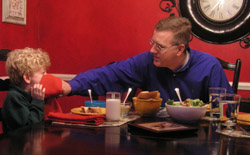 DINNER IS TIME FOR INDIANAPOLIS FAMILY TO PRAY TOGETHER
Howard Egger wipes the face of his 5-year-old son, Charlie, during dinner - a time when the Egger family regroups and prays together. During Lent Charlie's parents are getting him involved in cooking creative alternatives to traditional meatless meals on Fridays, a far cry from previous generations' dinners of tomato soup and grilled-cheese sandwiches, fish and filet-of-fish sandwiches from a fast-food restaurant. (CNS photo/John Shaughnessy, The Criterion) Image of DINNER IS TIME FOR INDIANAPOLIS FAMILY TO PRAY TOGETHER
Howard Egger wipes the face of his 5-year-old son, Charlie, during dinner - a time when the Egger family regroups and prays together. During Lent Charlie's parents are getting him involved in cooking creative alternatives to traditional meatless meals on Fridays, a far cry from previous generations' dinners of tomato soup and grilled-cheese sandwiches, fish and filet-of-fish sandwiches from a fast-food restaurant. (CNS photo/John Shaughnessy, The Criterion)