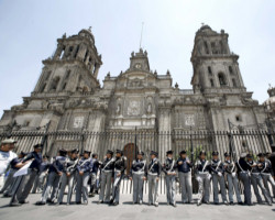 Police stand in front of the cathedral in Mexico City in this file photo from April. Services at the cathedral were suspended by the Mexico City Archdiocese after leftist protesters disrupted a Nov. 19 Mass. (CNS photo/Reuters) Image of Police stand in front of the cathedral in Mexico City in this file photo from April. Services at the cathedral were suspended by the Mexico City Archdiocese after leftist protesters disrupted a Nov. 19 Mass. (CNS photo/Reuters)