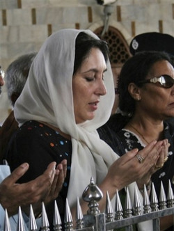 Pakistan's former Prime Minister Benazir Bhutto offers prayers at the tomb of Mohammad Ali Jinnah, founder of Pakistan,in this Oct. 22, 2007 file photo, in Karachi, Pakistan. Opposition leader Bhutto died Thursday, Dec. 27, 2007, a party aide said. A party security adviser says Bhutto was shot in the neck and chest as she got into her vehicle, then a gunman blew himself up. Image of Pakistan's former Prime Minister Benazir Bhutto offers prayers at the tomb of Mohammad Ali Jinnah, founder of Pakistan,in this Oct. 22, 2007 file photo, in Karachi, Pakistan. Opposition leader Bhutto died Thursday, Dec. 27, 2007, a party aide said. A party security adviser says Bhutto was shot in the neck and chest as she got into her vehicle, then a gunman blew himself up.