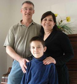 FORMATION - John and Lupita Sorich look forward to the First Communion of their son Michael. Parents of 11 children, the Soriches pray regularly with their children and teach them the wonder of Christ's presence in the Eucharist. Image of FORMATION - John and Lupita Sorich look forward to the First Communion of their son Michael. Parents of 11 children, the Soriches pray regularly with their children and teach them the wonder of Christ's presence in the Eucharist.