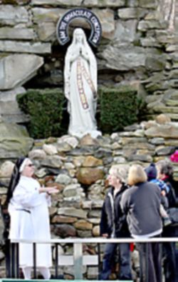 A HEALING PLACE - Sister Rochelle Guertal, of the Sisters of the Most Holy Trinity, director of the shrine, guides visitors Danica Jelovic, a member of St. Justin Martyr Parish, Eastlake, Nancy Teeters, St. a member of St. William Parish, Euclid, and Diana Teeters and her son Dominic, from Alburquerque, N.M. as they learn about the shrine. A HEALING PLACE - Sister Rochelle Guertal, of the Sisters of the Most Holy Trinity, director of the shrine, guides visitors Danica Jelovic, a member of St. Justin Martyr Parish, Eastlake, Nancy Teeters, St. a member of St. William Parish, Euclid, and Diana Teeters and her son Dominic, from Alburquerque, N.M. as they learn about the shrine.