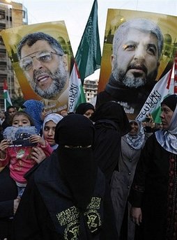 Young protesters hold banners showing the faces of assassinated Hamas leader Abdel Aziz Rantissi (L) and exiled leader Khaled Meshaal (R) during a demonstration outside the Egyptian embassy in Beirut. Meshaal called on Saturday for Palestinians to wage a new intifada against Israel, including a return to suicide missions. Image of Young protesters hold banners showing the faces of assassinated Hamas leader Abdel Aziz Rantissi (L) and exiled leader Khaled Meshaal (R) during a demonstration outside the Egyptian embassy in Beirut. Meshaal called on Saturday for Palestinians to wage a new intifada against Israel, including a return to suicide missions.