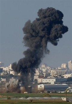 A cloud of smoke rises following an Israeli missile strike in the northern Gaza Strip, Friday, Jan. 2, 2009. Israel showed no sign of slowing a blistering seven-day offensive against Hamas militants in Gaza, destroying homes of the group's leaders and bombing one of its mosques a day after a deadly strike on a prominent Hamas figure killed him and most of his family. Image of A cloud of smoke rises following an Israeli missile strike in the northern Gaza Strip, Friday, Jan. 2, 2009. Israel showed no sign of slowing a blistering seven-day offensive against Hamas militants in Gaza, destroying homes of the group's leaders and bombing one of its mosques a day after a deadly strike on a prominent Hamas figure killed him and most of his family.