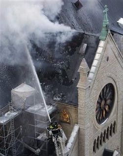 Chicago firefighters work in freezing temperatures on a extra-alarm fire at the Holy Name Cathedral, the seat of Cardinal Francis George, in Chicago, Wednesday, Feb. 4, 2009. Image of Chicago firefighters work in freezing temperatures on a extra-alarm fire at the Holy Name Cathedral, the seat of Cardinal Francis George, in Chicago, Wednesday, Feb. 4, 2009.