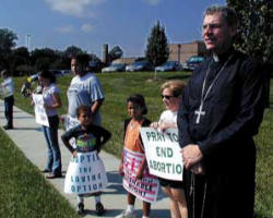 Occasionally we still hear an elected official speak of his or her personal opposition to abortion, while they support the legal right to an abortion.We should be very clear: Such a person places him or herself completely OUTSIDE the moral framework, the moral imperative of Evangelium Vitae and other Church teaching on these issues. ... They have abandoned their place in the citizenship of the Church. Quite simply they have become warriors for death rather than life. Image of Occasionally we still hear an elected official speak of his or her personal opposition to abortion, while they support the legal right to an abortion.We should be very clear: Such a person places him or herself completely OUTSIDE the moral framework, the moral imperative of Evangelium Vitae and other Church teaching on these issues. ... They have abandoned their place in the citizenship of the Church. Quite simply they have become warriors for death rather than life.