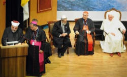 Pope Benedict XVI, center, listens along with Rabbi Shear Yashuv Cohen, left, Cardinal Tarcisio Bertone, second left, Latin Patriarch Fouad Twal, second right, and Sheikh Taysir Tamimi during an interfaith gathering at the Notre Dame Center in Jerusalem, Monday, May 11, 2009.
<br>Photo: AP Image of Pope Benedict XVI, center, listens along with Rabbi Shear Yashuv Cohen, left, Cardinal Tarcisio Bertone, second left, Latin Patriarch Fouad Twal, second right, and Sheikh Taysir Tamimi during an interfaith gathering at the Notre Dame Center in Jerusalem, Monday, May 11, 2009.
<br>Photo: AP