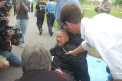 (Fr. Norm Weslin of Lambs of Christ being arrested.) Image of (Fr. Norm Weslin of Lambs of Christ being arrested.)
