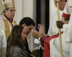 Alberto Cutie and fiancee renouncing their full communion with the Catholic Church by being received into the Episcopal Church. Image of Alberto Cutie and fiancee renouncing their full communion with the Catholic Church by being received into the Episcopal Church.