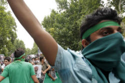 Over the past two days groups of protesters have gathered around the University Campus in Teheran and along the streets of the capital shouting slogans in favour of Moussavi, and 'down with dictatorship' throwing stones at riot police. Image of Over the past two days groups of protesters have gathered around the University Campus in Teheran and along the streets of the capital shouting slogans in favour of Moussavi, and 'down with dictatorship' throwing stones at riot police.