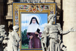 A tapestry depicting St Alphonsa is seen near statues during her canonisation ceremony in St Peter's Square in 2008. (CNS photo/Alessandro Bianchi, Reuters) Image of A tapestry depicting St Alphonsa is seen near statues during her canonisation ceremony in St Peter's Square in 2008. (CNS photo/Alessandro Bianchi, Reuters)