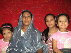 Khainur Islam and her daughters. Image of Khainur Islam and her daughters.