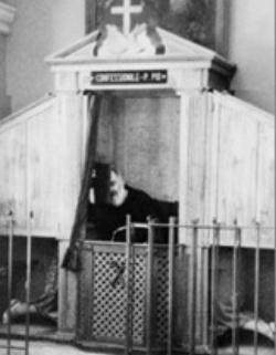 Padre Pio hearing Confessions. Image of Padre Pio hearing Confessions.
