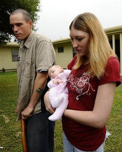 Army Pfc. Joseph Foster, left, who was wounded during the Thursday's Fort Hood shooting, along with his wife Mandi and 6-month-old daughter Keilee, speaks to the media outside his home Sunday, Nov. 8, 2009 in Fort Hood, Texas. Image of Army Pfc. Joseph Foster, left, who was wounded during the Thursday's Fort Hood shooting, along with his wife Mandi and 6-month-old daughter Keilee, speaks to the media outside his home Sunday, Nov. 8, 2009 in Fort Hood, Texas.