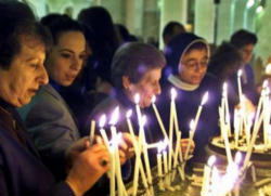 Palestinian Christians pray for peace. Image of Palestinian Christians pray for peace.