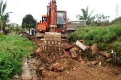 The Bulldozing of a Church in Vietnam. Image of The Bulldozing of a Church in Vietnam.