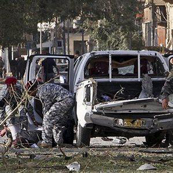 Iraqi police evacuate a victim of a bomb attack in Baghdad, Iraq, Monday, Jan. 25, 2010. Image of Iraqi police evacuate a victim of a bomb attack in Baghdad, Iraq, Monday, Jan. 25, 2010.